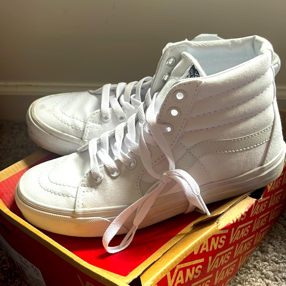 All white Sk8-Hi Vans